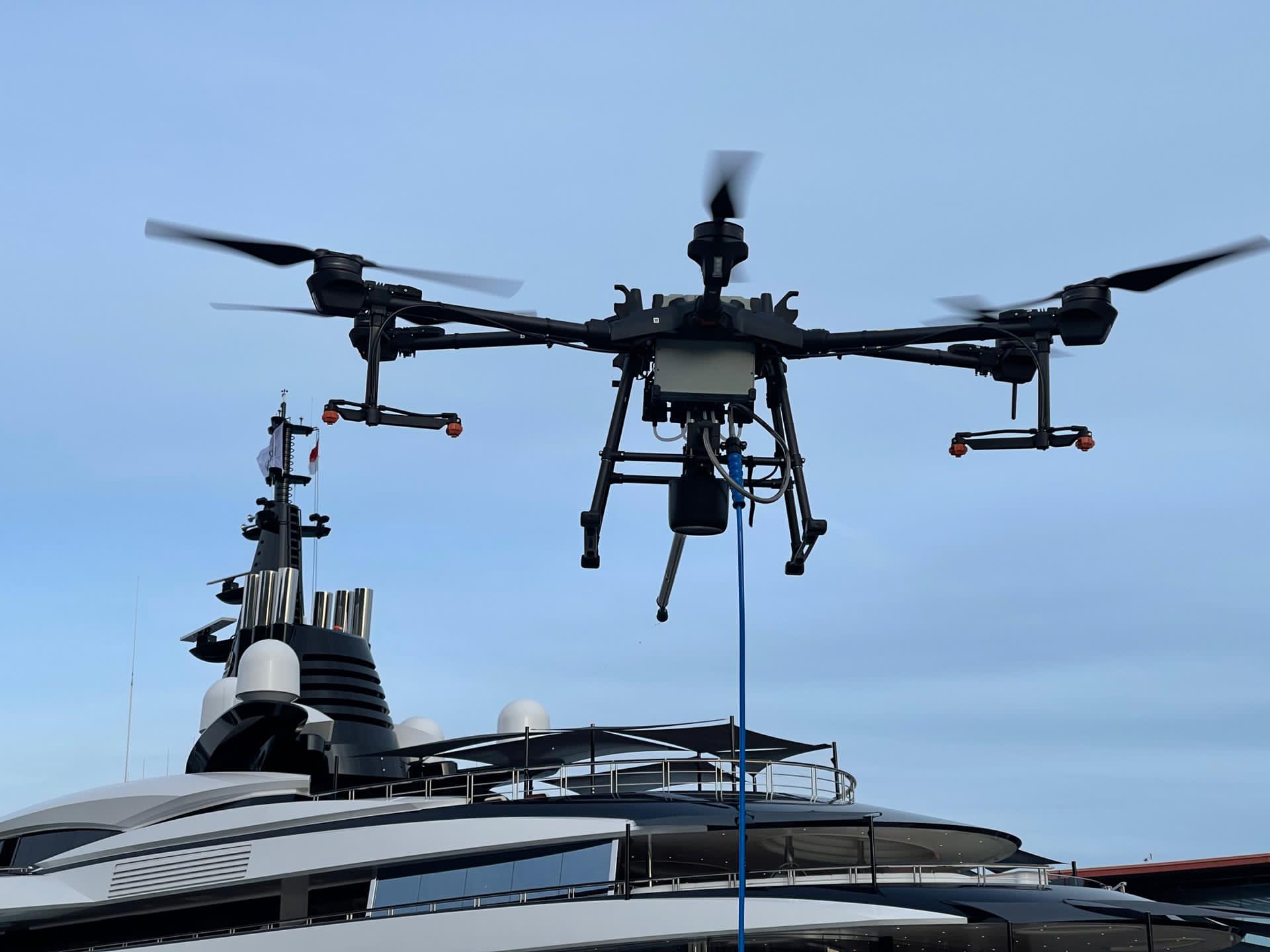 Drone cleaning a luxury yacht with precision, eco-friendly methods – Apex Drone Cleaning