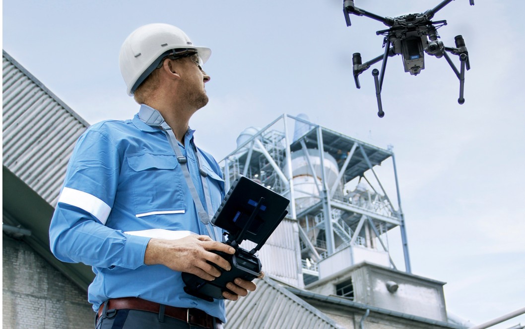 Drone inspection and cleaning services detecting facade damage with visual and thermal imaging